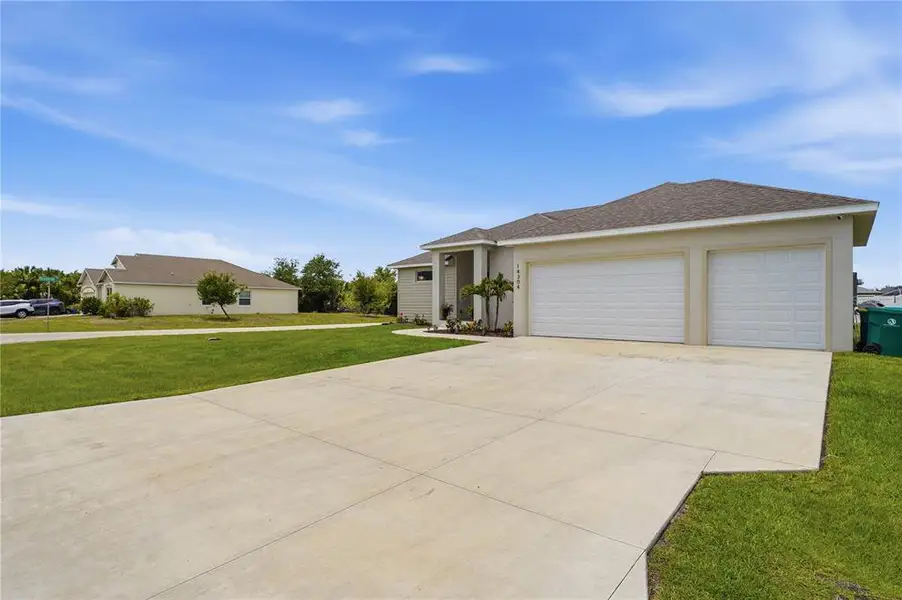 Front exterior of a new home in , Port Charlotte, FL, highlighting curb appeal (Image 1). Front exterior of a new home in , Port Charlotte, FL, highlighting curb appeal (Image 1).
