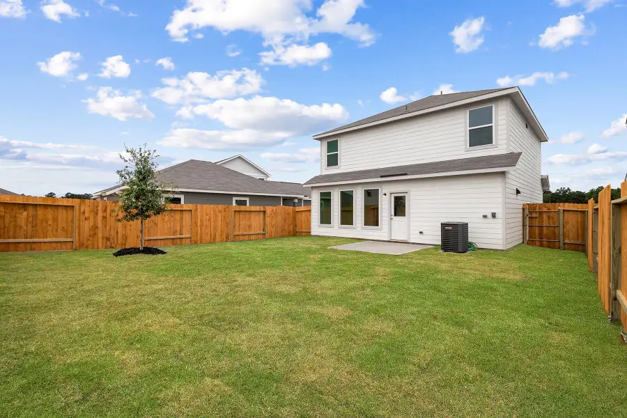 Exterior details and patio area of a home in Magnolia Woods, Magnolia (Image 3).