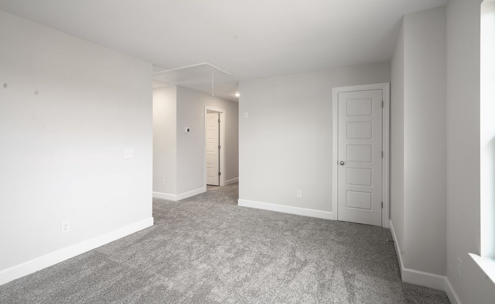 Representative unfurnished interior of a home built from the The McKee Manor by Cothran Homes in Holly Ridge, Greenville (Image 42). Representative unfurnished interior of a home built from the The McKee Manor by Cothran Homes in Holly Ridge, Greenville (Image 42).