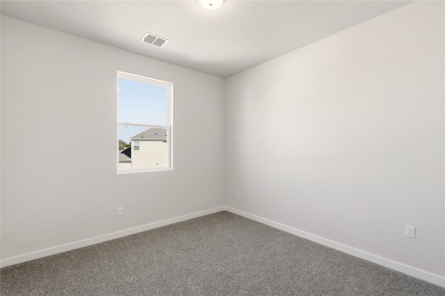 Empty room with baseboards and carpet