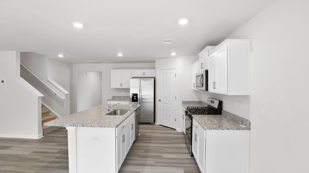 Furnished interior view inside a new home in Lakestone, Woodruff (Image 7).