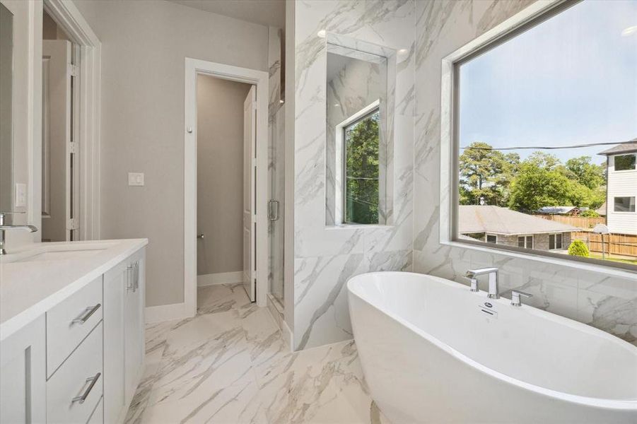 Primary bath with shower and soaking tub