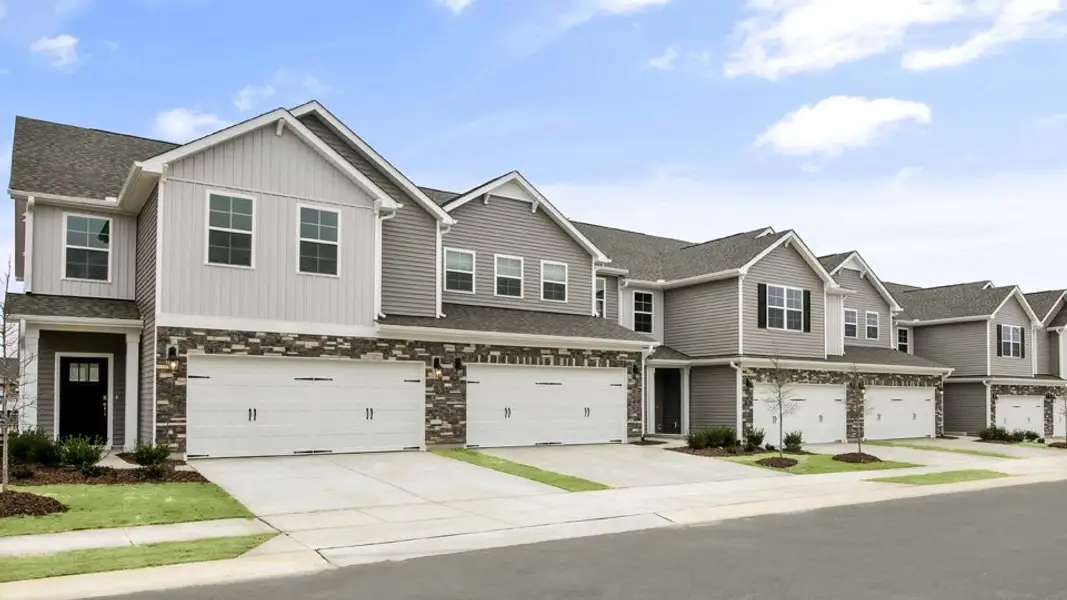 Front exterior of a new home in Lybrook Village, Advance, NC, highlighting curb appeal (Image 1).