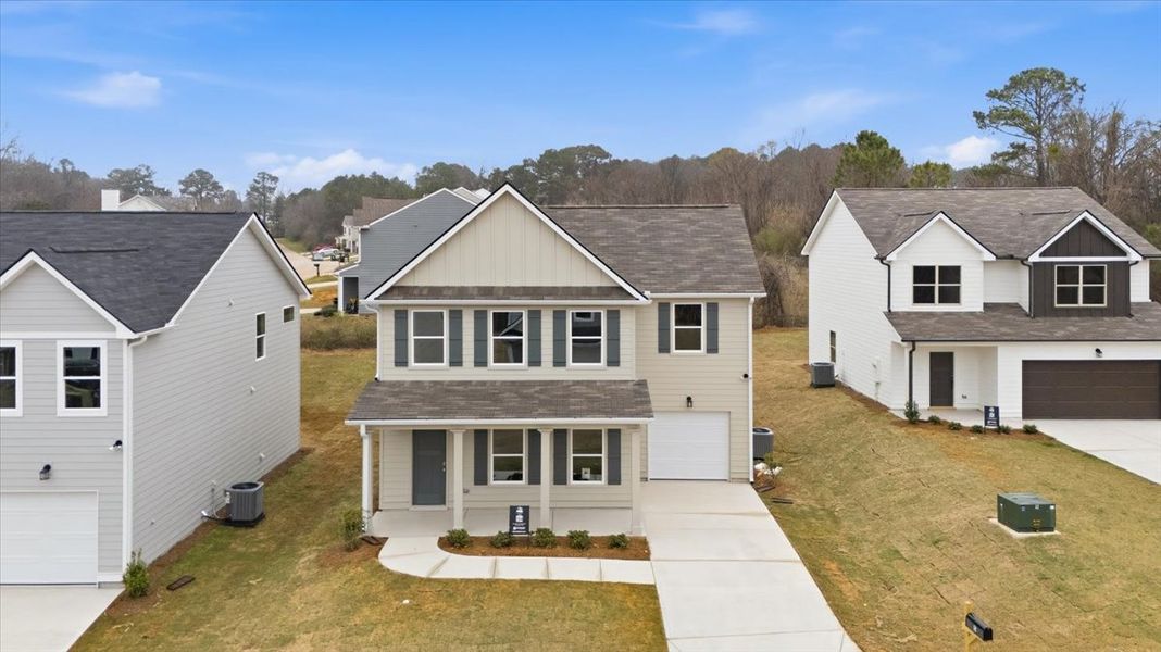 Front exterior of a new home in Creekside Manor, Thomaston, GA, highlighting curb appeal (Image 13).