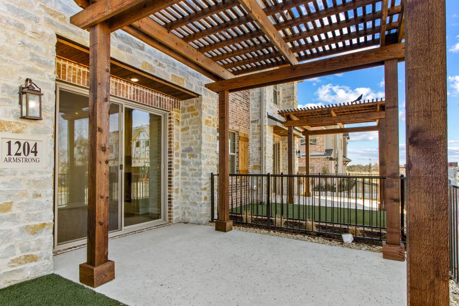 Exterior details and patio area of a home in The Tribute, The Colony (Image 4).