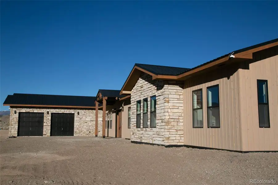 Large 2 car garage with extra door out back for ATV.