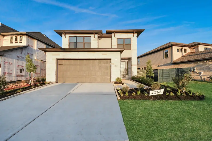 Front exterior of a new home in Austin Point, Richmond, TX, highlighting curb appeal (Image 1). Front exterior of a new home in Austin Point, Richmond, TX, highlighting curb appeal (Image 1).