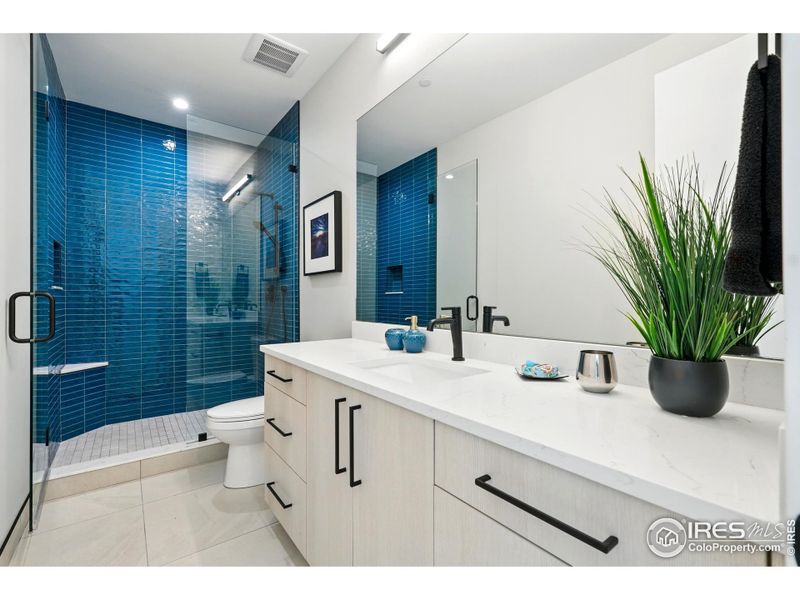 Main level en-suite + heated tile floors Main level en-suite + heated tile floors