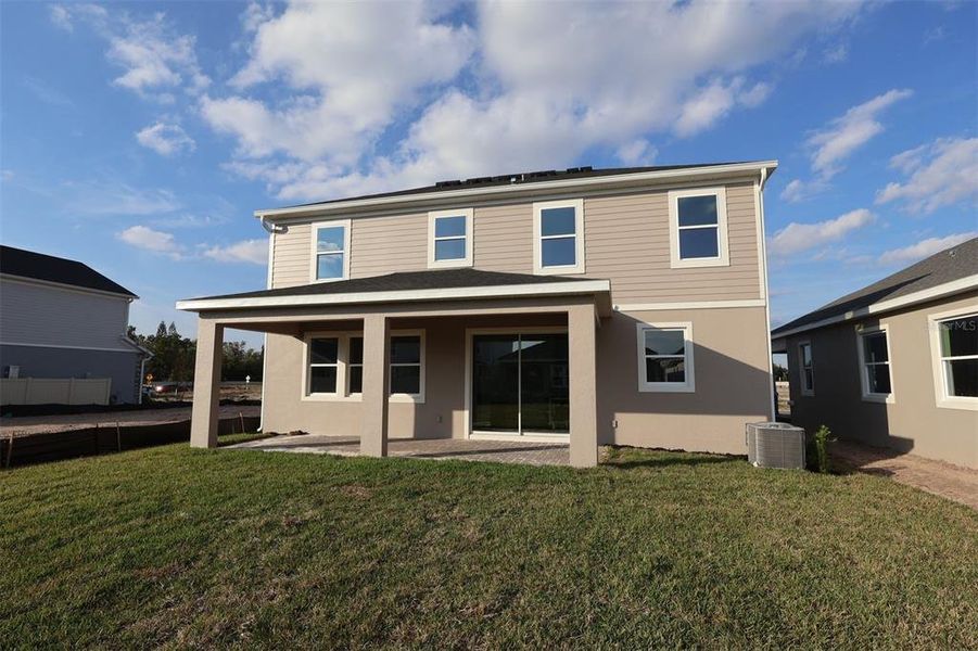 Exterior details and patio area of a home in Center Lake on the Park, St. Cloud (Image 2).