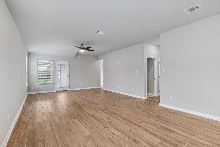 Dining room and living room in the Allen floorplan at a Meritage Homes community. Dining room and living room in the Allen floorplan at a Meritage Homes community.