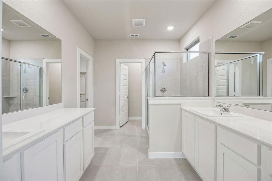 Primary Bathroom in the Wimbledon home plan by Trophy Signature Homes – REPRESENTATIVE PHOTO Primary Bathroom in the Wimbledon home plan by Trophy Signature Homes – REPRESENTATIVE PHOTO