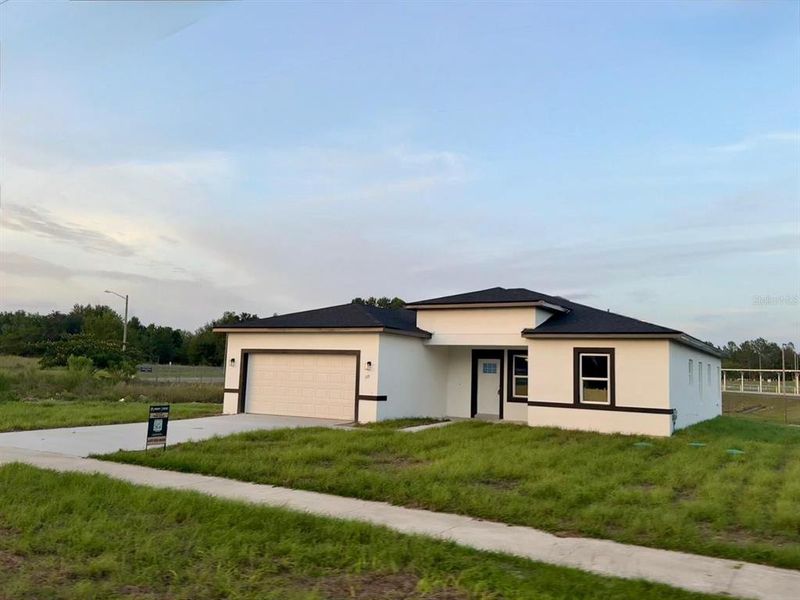 Front exterior of a new home in , Ocala, FL, highlighting curb appeal (Image 23).