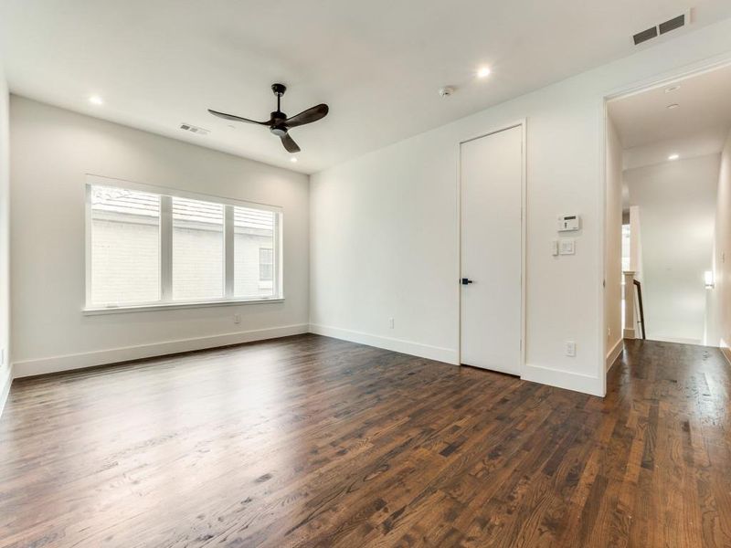 Spacious Primary bedroom with beautiful hardwood floors