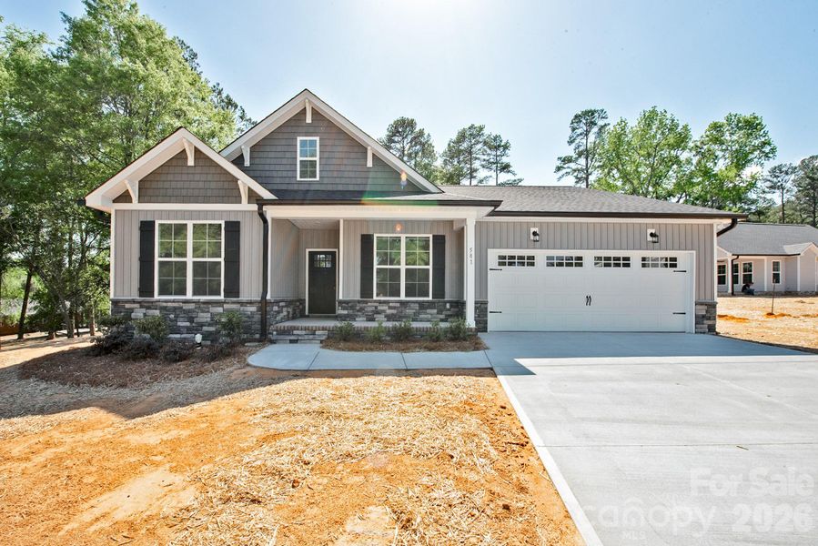 Front exterior of a new home in , Concord, NC, highlighting curb appeal (Image 21).