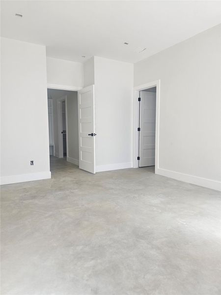 View of bedroom entry and bathroom door