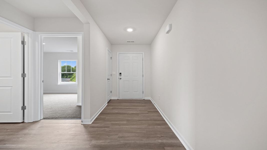 Spacious, unfurnished interior of a new home in Bentley Park, Greenwood (Image 9).