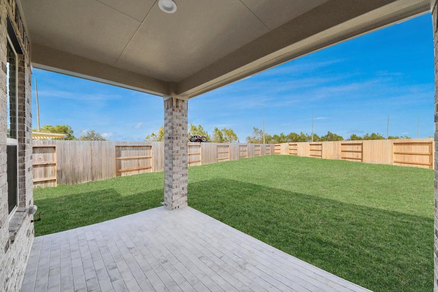 Experience outdoor living at its finest on this expansive covered patio, thoughtfully designed for BBQs and delightful outdoor dining. Experience outdoor living at its finest on this expansive covered patio, thoughtfully designed for BBQs and delightful outdoor dining.