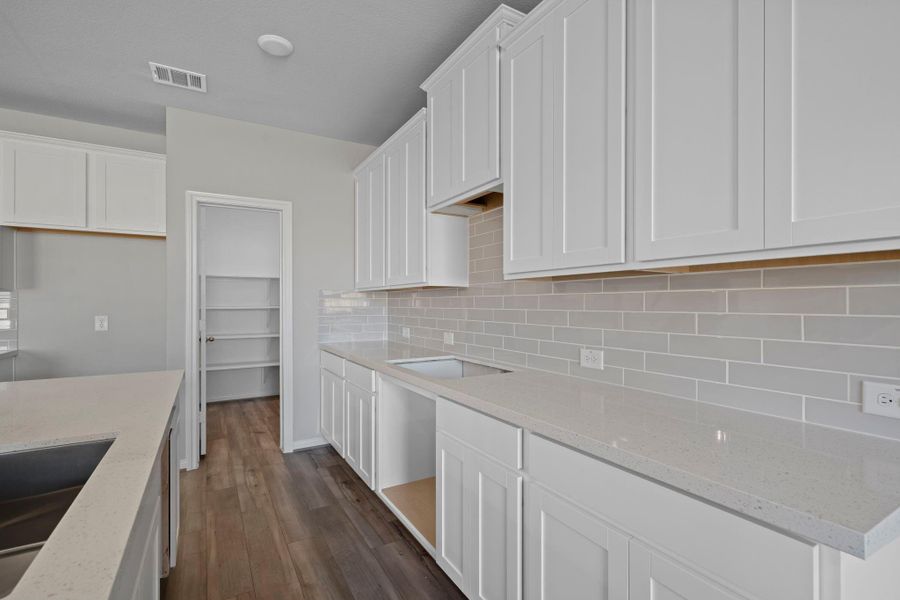This kitchen is not only a functional space but also has ample storage. Whether you're a seasoned chef or just love to gather and enjoy good food, this kitchen is a dream come true.