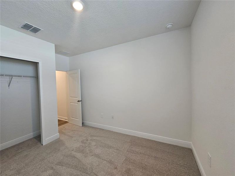 Spacious, unfurnished interior of a new home in The Reserve at Hammock Oaks - Signature Series, Lady Lake (Image 36).