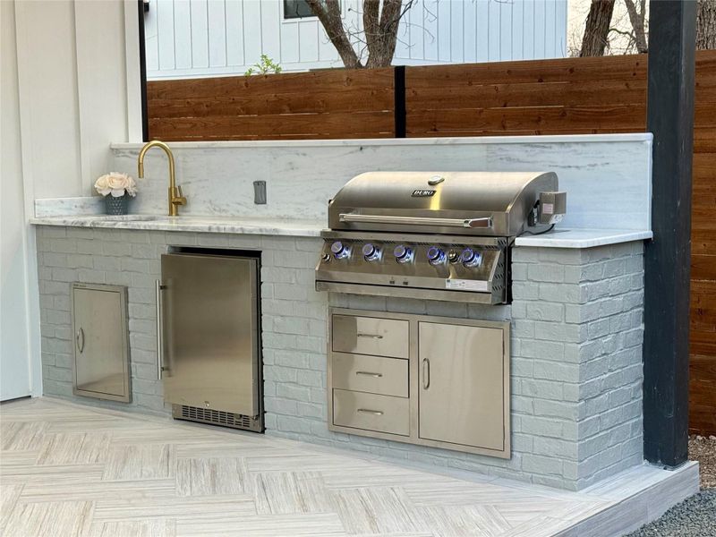 View of patio / terrace featuring exterior kitchen