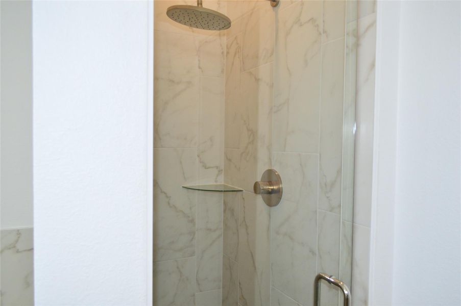 Bathroom view of a marble finish shower Bathroom view of a marble finish shower