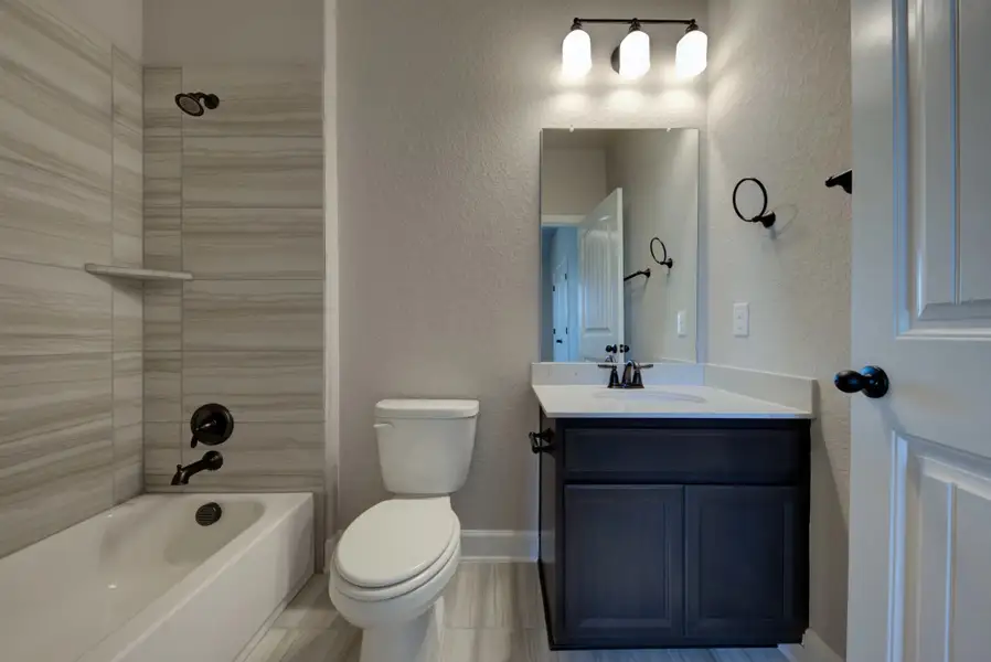 Representative furnished interior of a home built from the Barnett by Ashton Woods in Sunday Creek at Kinder Ranch, San Antonio (Image 12).