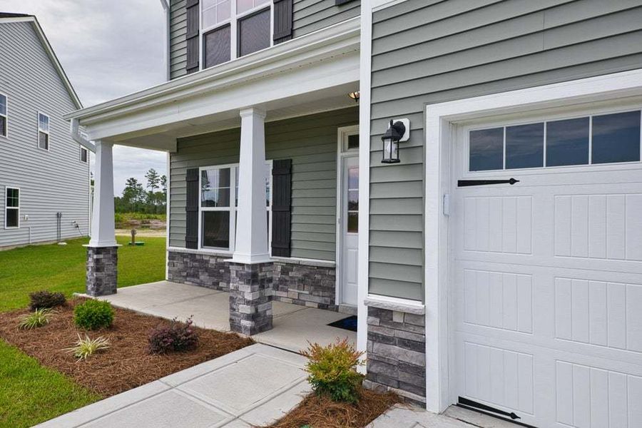 Representative exterior photo of a completed home built from the Pamlico by Caviness & Cates Communities in Bartlett Manor, Youngsville, NC (Image 17).