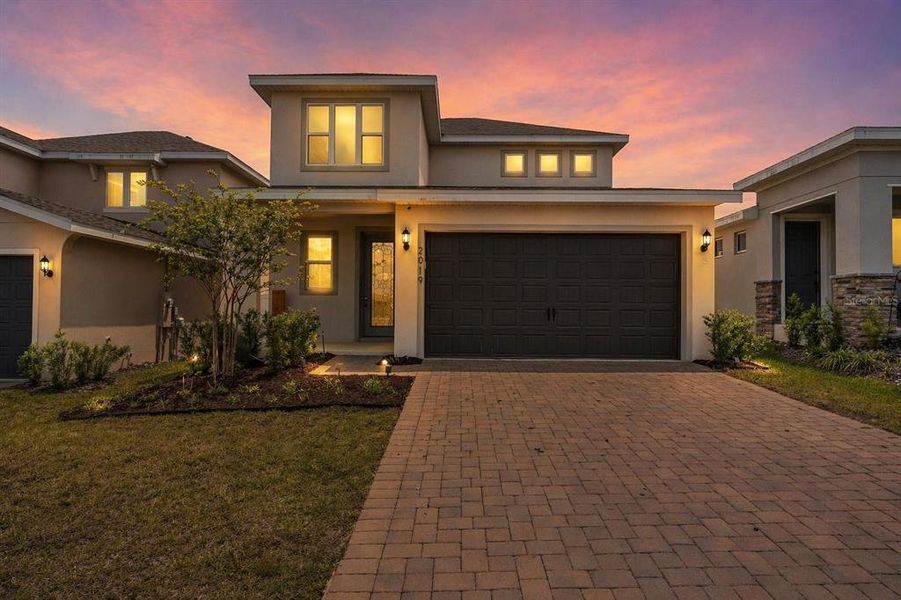 Front exterior of a new home in Hills of Minneola, Minneola, FL, highlighting curb appeal (Image 1). Front exterior of a new home in Hills of Minneola, Minneola, FL, highlighting curb appeal (Image 1).