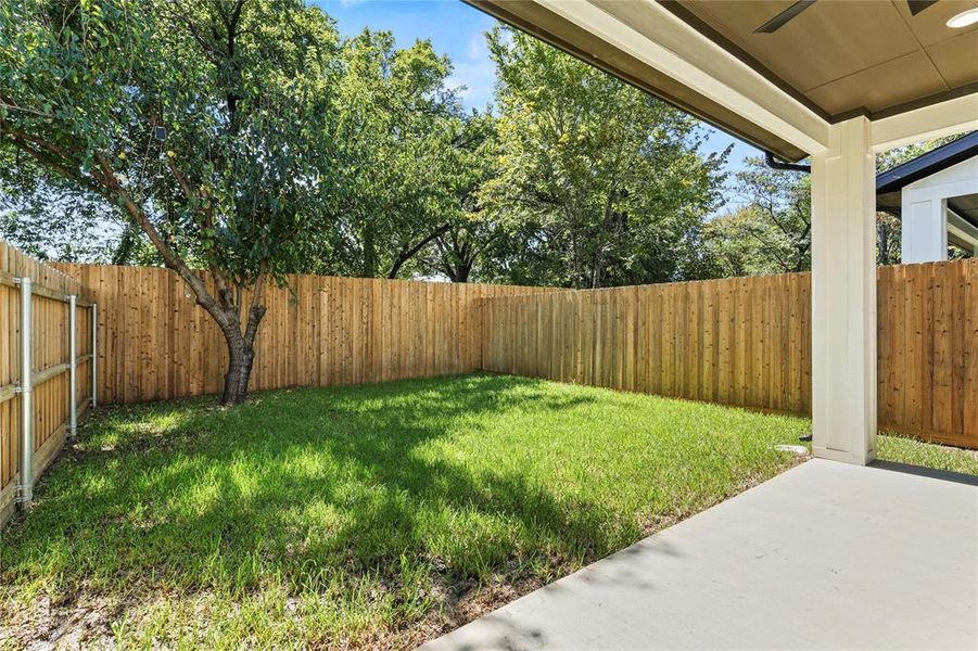 Fenced backyard featuring a patio area Fenced backyard featuring a patio area