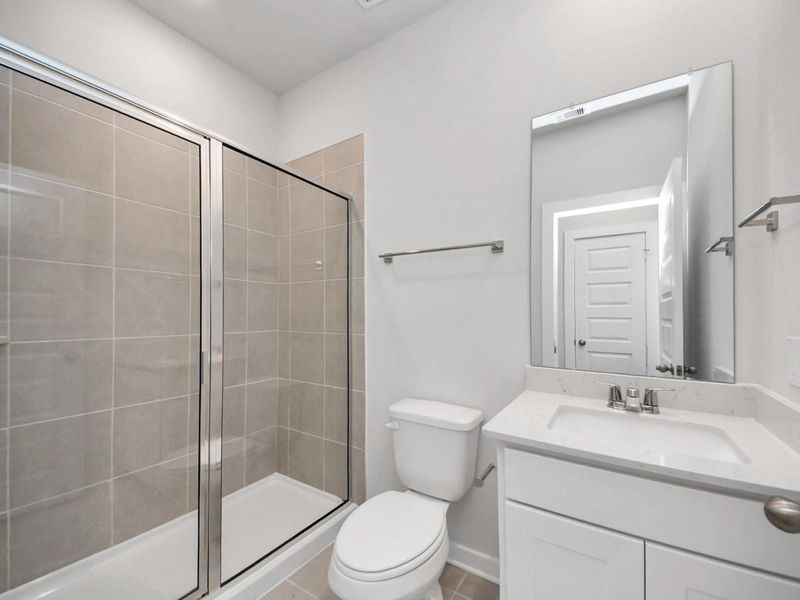 Furnished interior view inside a new home in Caney Creek Place, Conroe (Image 14).