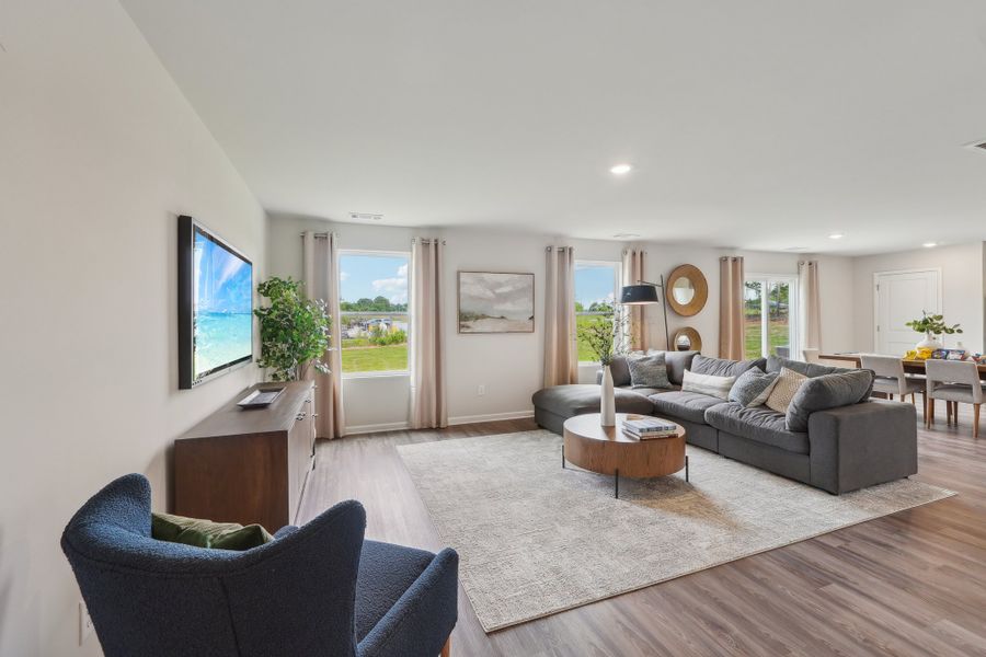 A living room with a large tv.