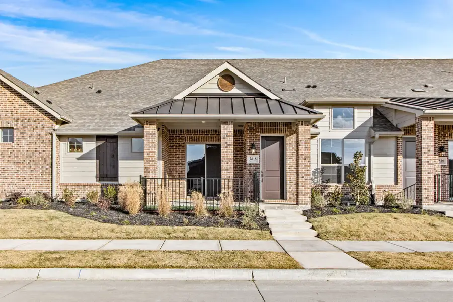 Front exterior of a new home in Woodbridge Villas, Wylie, TX, highlighting curb appeal (Image 1). Front exterior of a new home in Woodbridge Villas, Wylie, TX, highlighting curb appeal (Image 1).