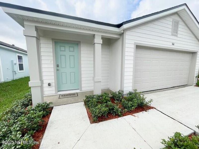 Exterior details and patio area of a home in Grand Reserve, Bunnell (Image 35).