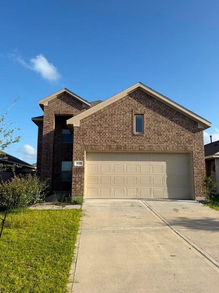 Front exterior of a new home in Windrose Green, Angleton, TX, highlighting curb appeal (Image 1). Front exterior of a new home in Windrose Green, Angleton, TX, highlighting curb appeal (Image 1).
