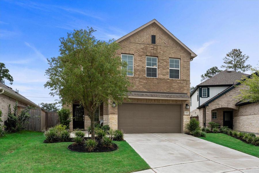 Front exterior of a new home in Sorella, Tomball, TX, highlighting curb appeal (Image 23).