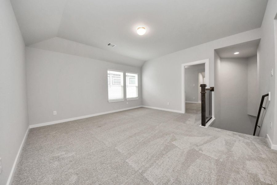 Come upstairs and enjoy a day of leisure in this fabulous game room! This is the perfecthangout spot or adult game room! Features plush carpet, high ceilings, custom paint andwindows for plenty of natural light.