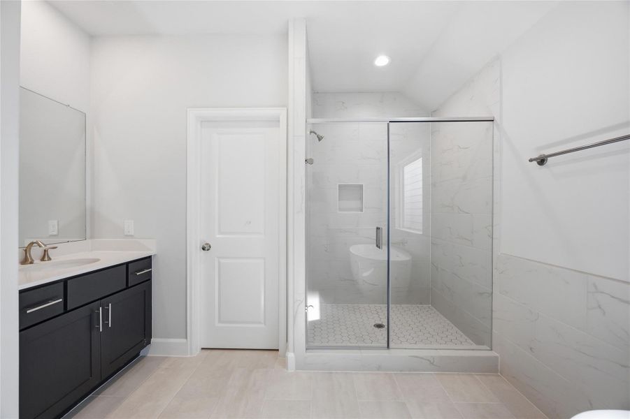 Shower in Style: Revel in the expansiveness of a large shower, standard with sleek finishes and a built-in niche, keeping essentials elegantly within reach.