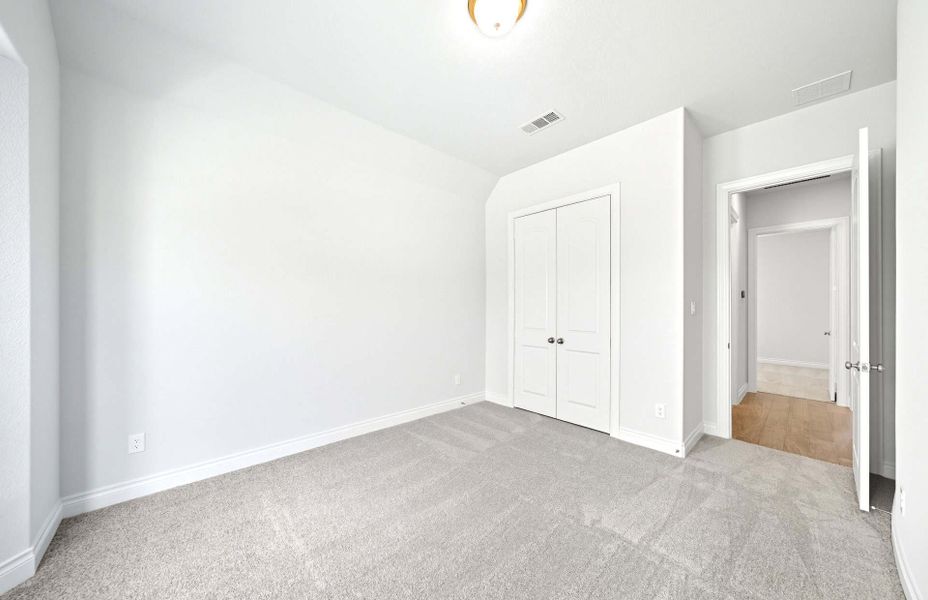 Representative unfurnished interior of a home built from the 3663 by Ravenna Homes in Artavia 70′, Conroe (Image 35).