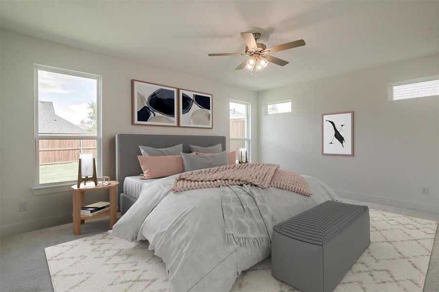 Bedroom with ceiling fan and light colored carpet