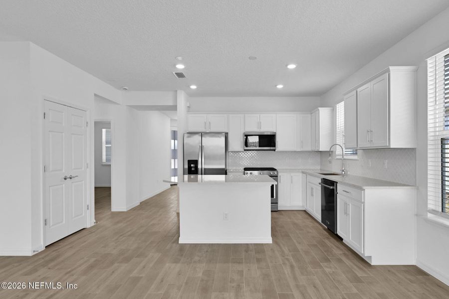Furnished interior view inside a new home in Del Webb Wildlight, Yulee (Image 11).