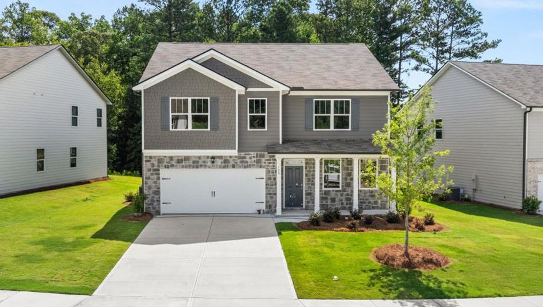 Front exterior of a new home in Northwoods at Mirror Lake, Villa Rica, GA, highlighting curb appeal (Image 21).