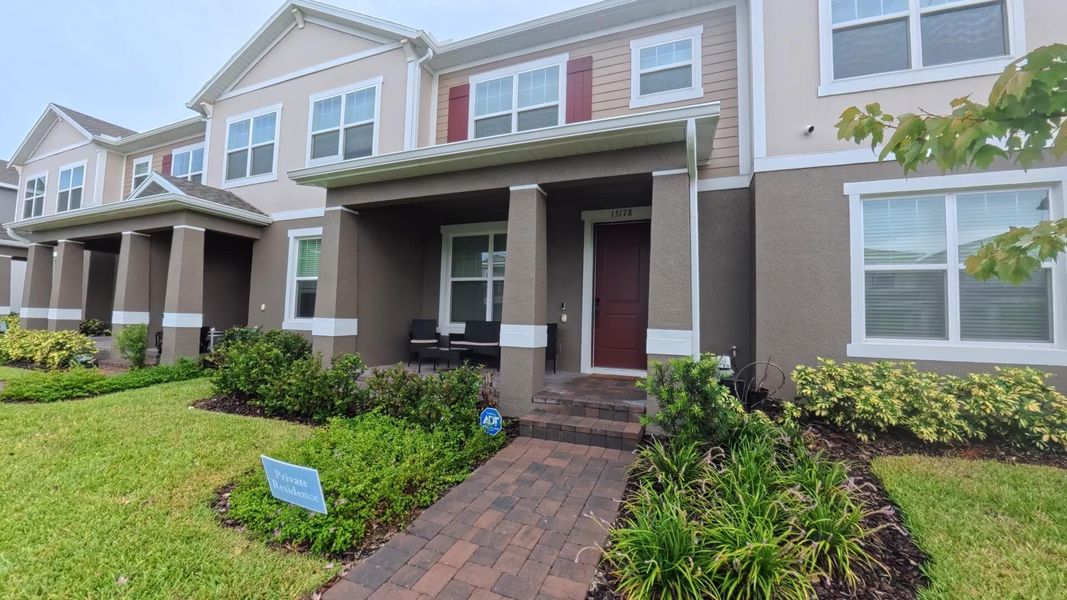 Front exterior of a new home in , Winter Garden, FL, highlighting curb appeal (Image 20).