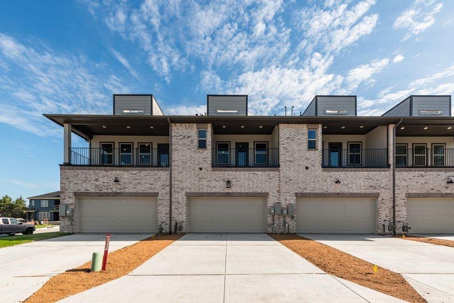 Front exterior of a new home in Bayside, Rowlett, TX, highlighting curb appeal (Image 22).