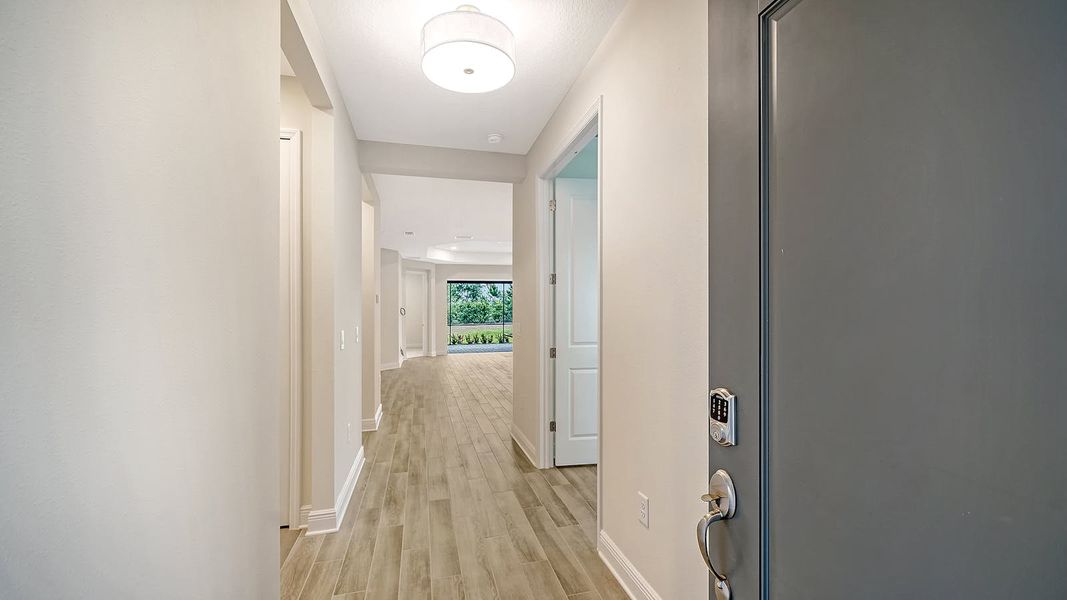 Spacious, unfurnished interior of a new home in Palm Grove Real Estate and Homes for Sale in Lakewood Ranch, FL - Neal Communities, Lakewood Ranch (Image 14). Spacious, unfurnished interior of a new home in Palm Grove Real Estate and Homes for Sale in Lakewood Ranch, FL - Neal Communities, Lakewood Ranch (Image 14).