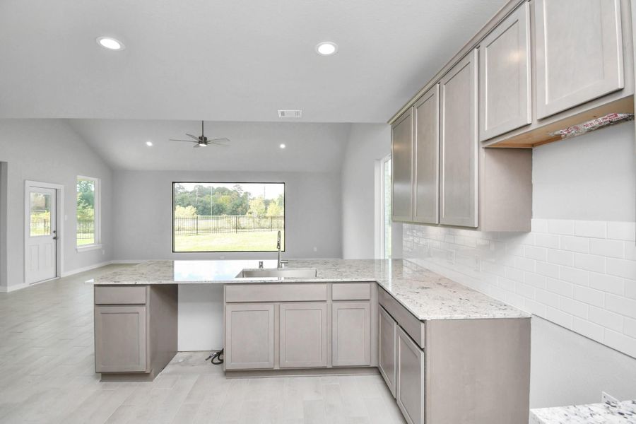 The extended counter area adds both practicality and style, making meal preparation a breeze. Every detail is thoughtfully designed to enhance the kitchen's functionality and aesthetic appeal. The extended counter area adds both practicality and style, making meal preparation a breeze. Every detail is thoughtfully designed to enhance the kitchen's functionality and aesthetic appeal.