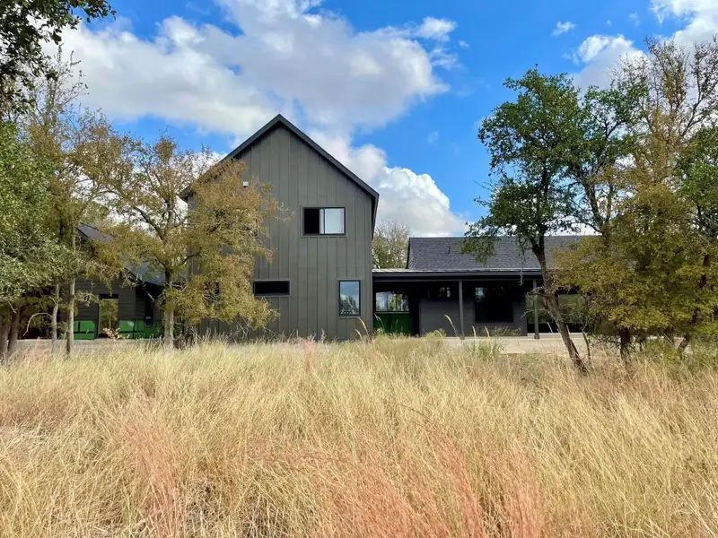 Back of property featuring board and batten siding Back of property featuring board and batten siding
