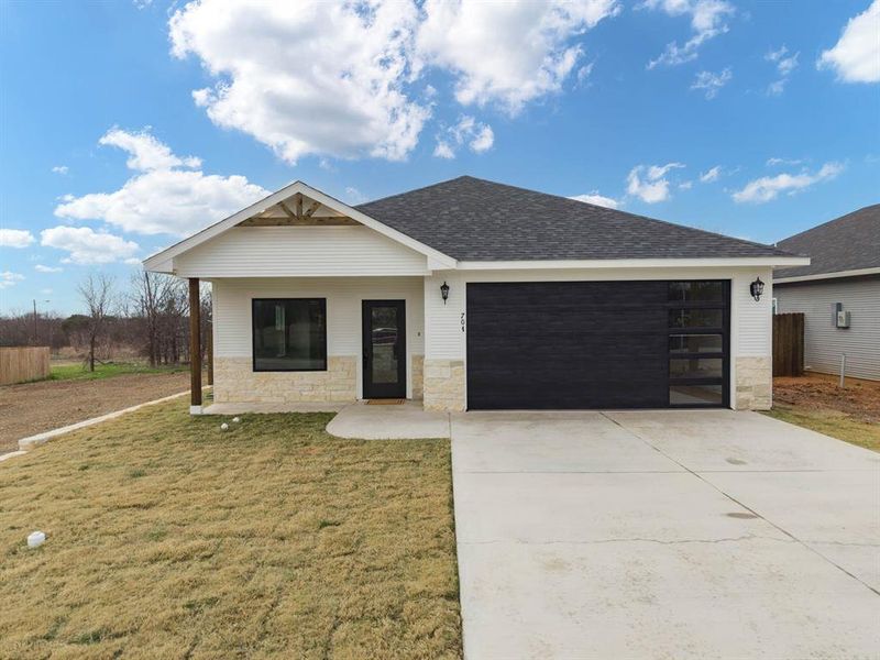 Front exterior of a new home in , Hillsboro, TX, highlighting curb appeal (Image 2). Front exterior of a new home in , Hillsboro, TX, highlighting curb appeal (Image 2).