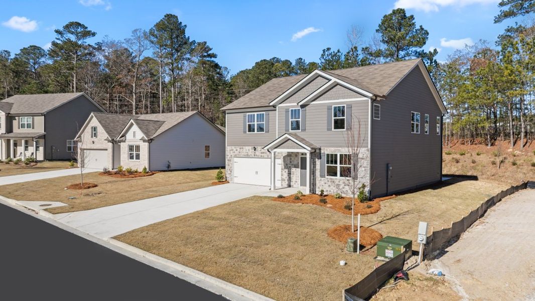 Representative exterior photo of a completed home built from the Halton by D.R. Horton in Northwoods at Mirror Lake, Villa Rica, GA (Image 22).