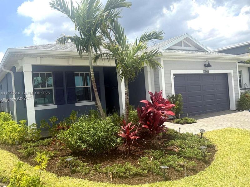 Front exterior of a new home in Tradition, Port St. Lucie, FL, highlighting curb appeal (Image 25).