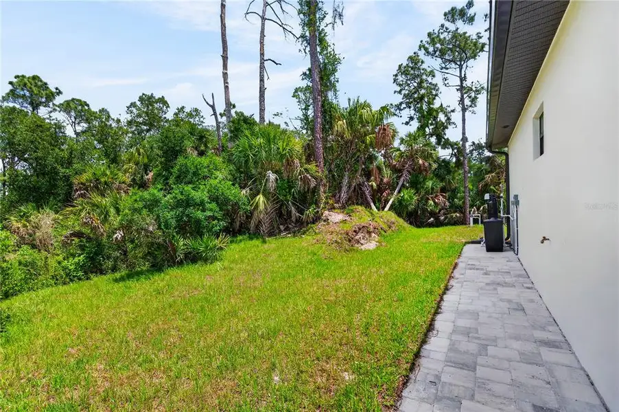 Exterior details and patio area of a home in , North Port (Image 48).